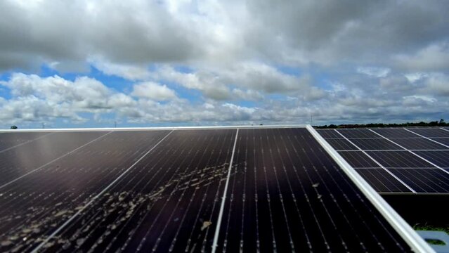 Cinematic renewable energy motion lapse from right to left of Solar panel arrays at TBEA NAWEC solar power plant in Jambur Gambia, West Africa for sustainable development goals