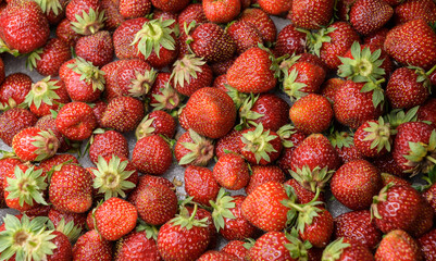 Natural looking fresh red strawberry in package. - 635762942