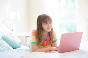 Teenager and computer. Girl chatting with friends.