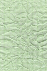 Crumpled green grid paper texture
