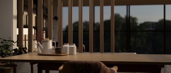 Close-up image of a copy space on a wooden dining table in a cozy contemporary dining room.