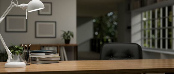 Copy space on a wooden desk in a modern home office room. close-up image.