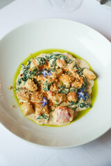 Potato gnocchi with crab meat and spinach