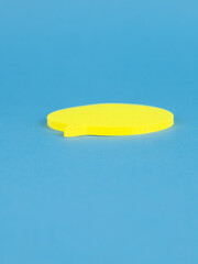 Yellow blank sticky paper sheets, isolated on blue  background