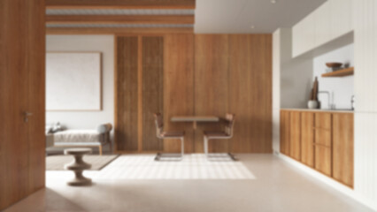 Blurred background, wooden japandi kitchen, dining and living room with resin floor and beams ceilings. Sofa and table with chairs. Minimalist interior design