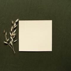 Blank greeting card, invitation and envelope mockup. Minimal floral frame made of dry spikelets. Flat lay, top view. Happy mother's day, women's day or birthday, wedding composition.