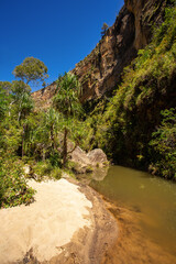Isalo National Park in Ihorombe Region. Wilderness landscape with water erosion into rocky...