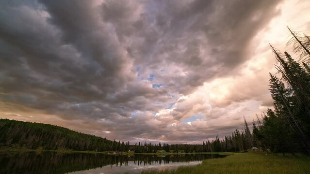 Sunset timelapse over Lyman Lake in the Utah wilderness as clouds change colors.