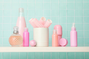 A shelf in the bathroom with care products.