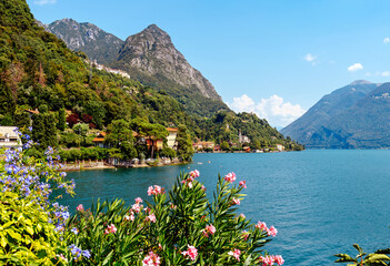 Italy, Lake Lugano. View of the lake, mountains, houses standing above the lake.