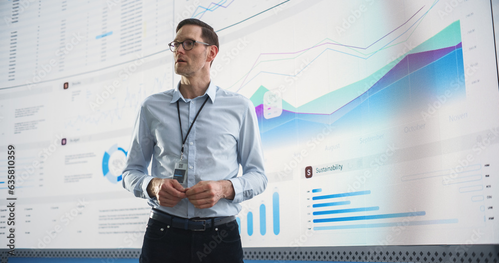 Aufkleber male ceo of data science company is giving presentation in front of big digital screen with graphs a