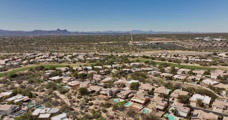 Tucson Arizona Aerial v7 flyover and around Oro Valley Canada Hills neighborhoods with golf course, capturing panoramic views of mountainscape and desert views - Shot with Mavic 3 Cine - March 2022