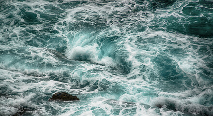 Stormy sea surf breaks on the rocks - 635810780