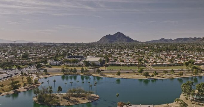 Scottsdale Arizona Aerial v5 drone flyover Chaparral Lake and Villa Monterey neighborhood towards Camelback mountain capturing cityscape with desert views - Shot with Mavic 3 Cine - February 2022