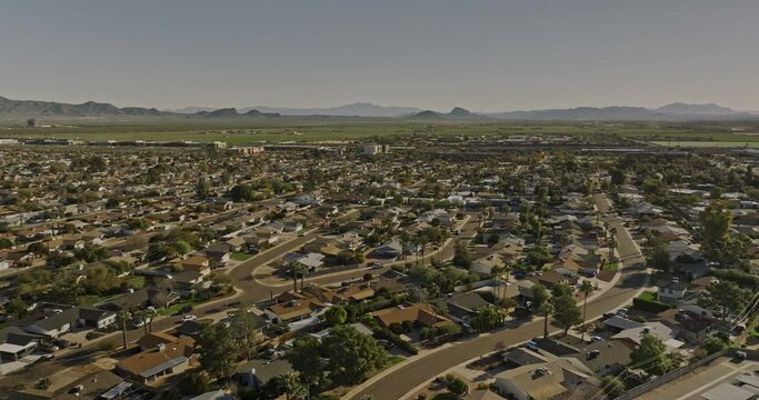Scottsdale Arizona Aerial v1 panoramic panning view above Chateau De Vie neighborhood capturing tillable farmland, cityscape of desert city, camelback mountain - Shot with Mavic 3 Cine - February 2022
