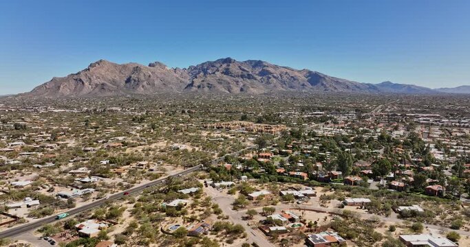 Tucson Arizona Aerial v2 panoramic panning views drone flyover Casas Adobes and Casas Catalinas neighborhoods capturing rocky mountainscape and desert views - Shot with Mavic 3 Cine - March 2022