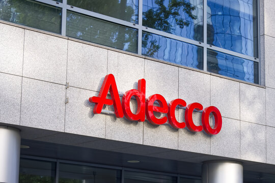 Sign of Adecco Company ,signboard Adecco, Warsaw, Poland. August 17, 2023 