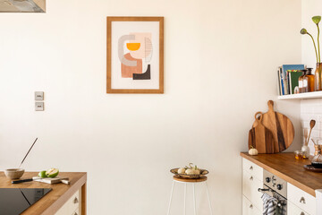Minimalist composition of kitchen interior with mock up poster frame, white kitchen furniture,...