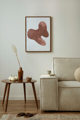 Creative composition of living room interior with mock up poster frame, modern beige sofa, oval...