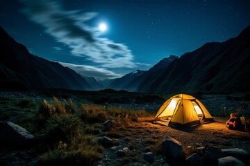 Fototapeta na wymiar A tent glows under a night sky full of stars. Outdoor adventure, nature landscape