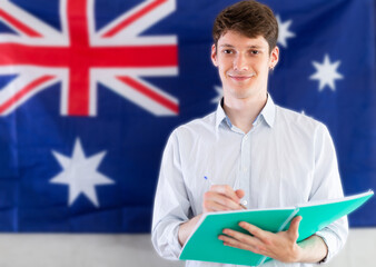  Positive student on the background of the flag of Australia