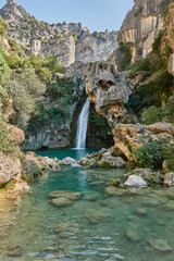 Fototapeta na wymiar The Borosa River with its waterfalls, including La Calavera, in the Salto de los Órganos area, in the Cazorla, Segura and Las Villas mountains. Jaen. Andalusia. Spain.