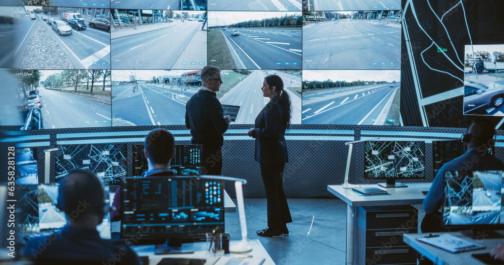 Poster Team of Software Developers, Engineers and Data Scientists Working in a Modern Logistics Technology Company. Male and Female Having a Discussion in Front of a Screen with Surveillance CCTV Footage