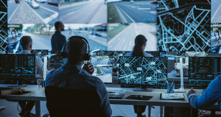 Diverse Team of Specialists Analyze Surveillance Feeds, Monitor Targets on a GPS City Map, Ensure...