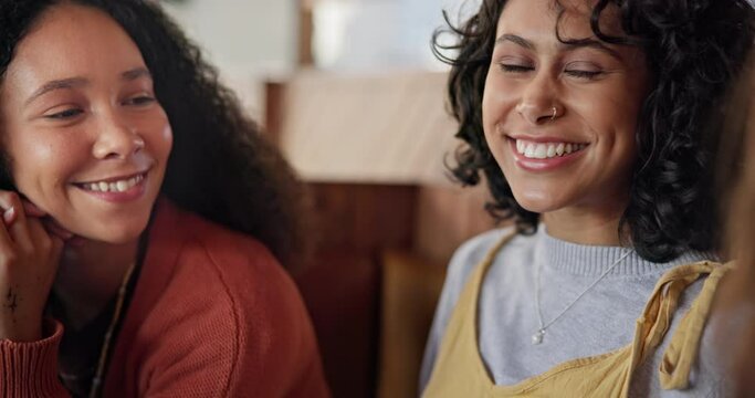 Happy, talking and friends at a cafe for conversation, communication or bonding together. Smile, chat and teenage girls or people at a coffee shop for a discussion, weekend fun or friendship
