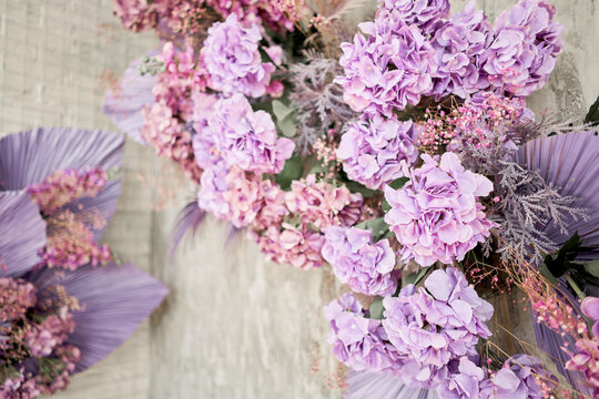 Decorate wall backdrop of artificial leaf and hydrangea. It is wedding time. Lilac and violet colors. hydrangea , beautiful spring bouquet.