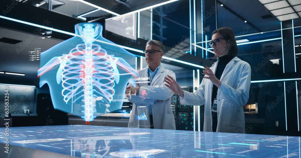 Fototapete two bioengineers working with computer-powered vfx hologram of human chest with heart and blood flow