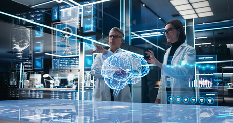 Two Neuroscientists Working With Computer-Powered VFX Hologram Of Human Brain And Nervous System In Futuristic Laboratory. Caucasian Man And Woman Working On Solutions for Brain Damage. High Tech.