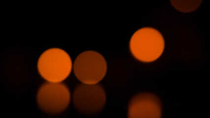 Bokeh background image of candlelight in the dark