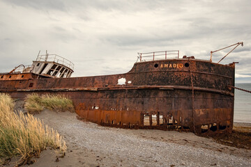 Shipwreck called Amadeo on the  coast of Magellan Strait, rusty warship wreck, Tierra Del Fuego, Chile