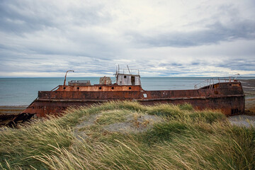 Shipwreck called Amadeo on the  coast of Magellan Strait, rusty warship wreck, Tierra Del Fuego,...