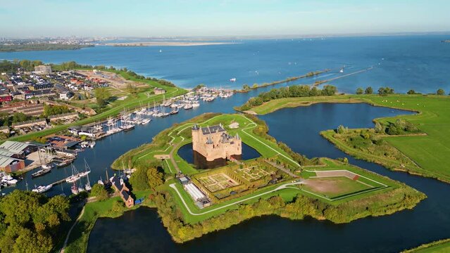 Aerial View on Muiderslot Castle in Muiden, Netherlands, panning around. The Castle dates from the late 14th Century.