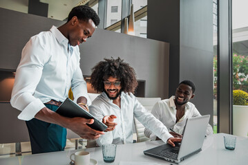 Obraz premium a happy multi ethnic male team working together at the office