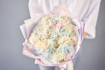 Beautiful mono bouquet of flowers in woman hand. Floral shop concept . Beautiful fresh cut bouquet....