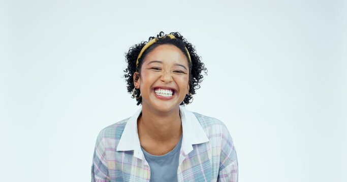 Funny, face and woman with tongue out and smile in studio white background and emoji for happiness in fashion or style. Gen z, girl and portrait of black woman with facial expression, joke or laugh