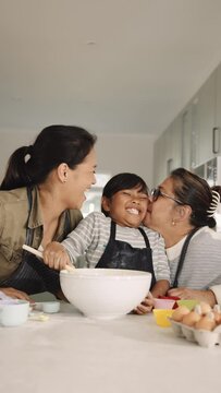 3 Generational Multi Ethnic Asian Family Baking Together