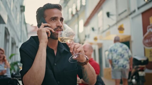 Calling man drinking wineglass street cafe close up. Businessman talking phone