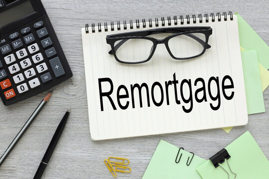 REMORTGAGE - . Business and finance concept top view of open notepad with text. points on the page.