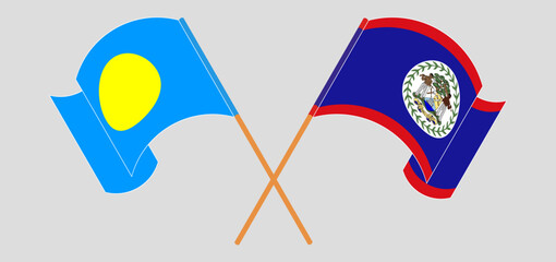 Crossed and waving flags of Palau and Belize