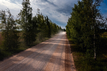Dusty gravel road in summertime.