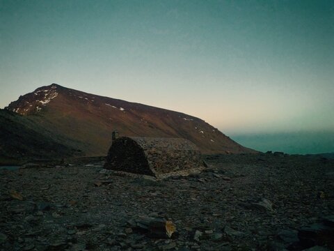 view of caldera refuge and mulhacen peak at sunset in sierra nevada mountains