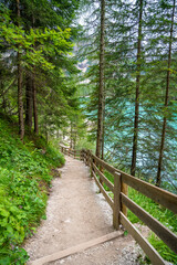 Path for walking around the Braies lake or Pragser Wildsee in the Dolomites, South Tyrol, Italy