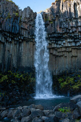 Svartifoss is a thin, 20m-high waterfall tumbling down the center of a dramatic 3D wall of hexagonal basalt columns.