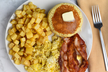 scramble eggs with hash browns and pancacakes