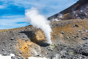 Active volcano Asahidake with fumaroles emitting sulphuric gases in Hokkaido