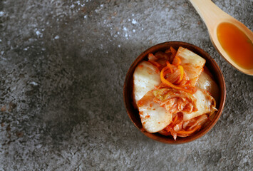 traditional cabbage fermented kimchi in a wooden bowl